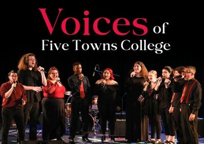 A group of 10 students wearing red and black attire stand in a semi circle. All are holding microphones and have their moths open, indicating singing. Behind them is a band with microphones set up. image - click to enlarge